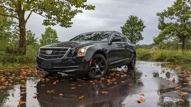 A Black Cadillac Car Parked on the Street