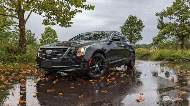 A Black Cadillac Car Parked on the Street 