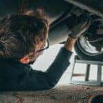 Man Fixing Vehicle Engine