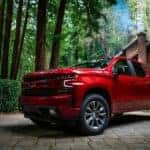Red Chevrolet Silverado 1500 in the Driveway of a Forest Cottage