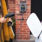 A woman charging an EV