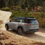 Nissan Pathfinder on a dirt trail in the forest