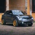 Parked Gray Nissan Juke with its Lights On