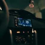 A dashboard of a car with a digital screen