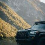 Black Toyota Tacoma in Mountains