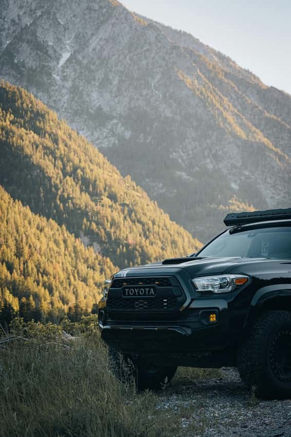 Black Toyota Tacoma in mountains