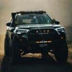 Off-Road Toyota Truck in Dusty Landscape