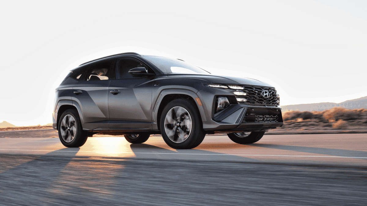 2025 Hyundai Tucson in motion at sunset, ideal for arriving in style at Athens community events.