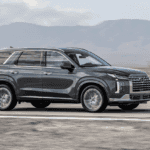Side shot of the 2025 Hyundai Palisade cruising through Athens, GA, emphasizing the importance of service intervals for reliability.