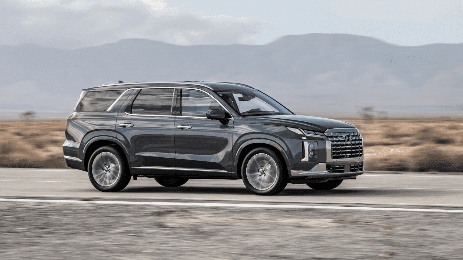 Side shot of the 2025 Hyundai Palisade cruising through Athens, GA, emphasizing the importance of service intervals for reliability.
