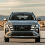 Front view of the 2025 Hyundai Tucson Plug-in Hybrid parked in Athens, GA, highlighting its modern grille and plug-in hybrid efficiency.
