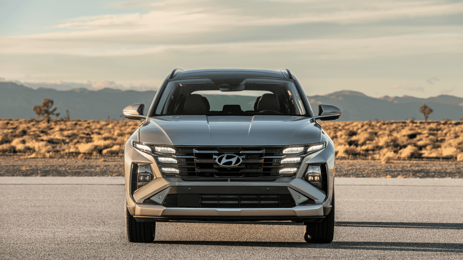 Front view of the 2025 Hyundai Tucson Plug-in Hybrid parked in Athens, GA, highlighting its modern grille and plug-in hybrid efficiency.