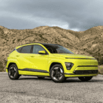 Bright green 2025 Hyundai Kona Electric parked in the Athens, GA countryside, showcasing its eco-friendly design and urban versatility.