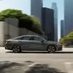 2025 Hyundai Elantra Hybrid driving through a modern cityscape with sleek design and fuel-efficient performance.