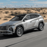 2025 Hyundai Tucson Plug-in Hybrid SUV driving in the desert, combining SUV versatility with hybrid efficiency.