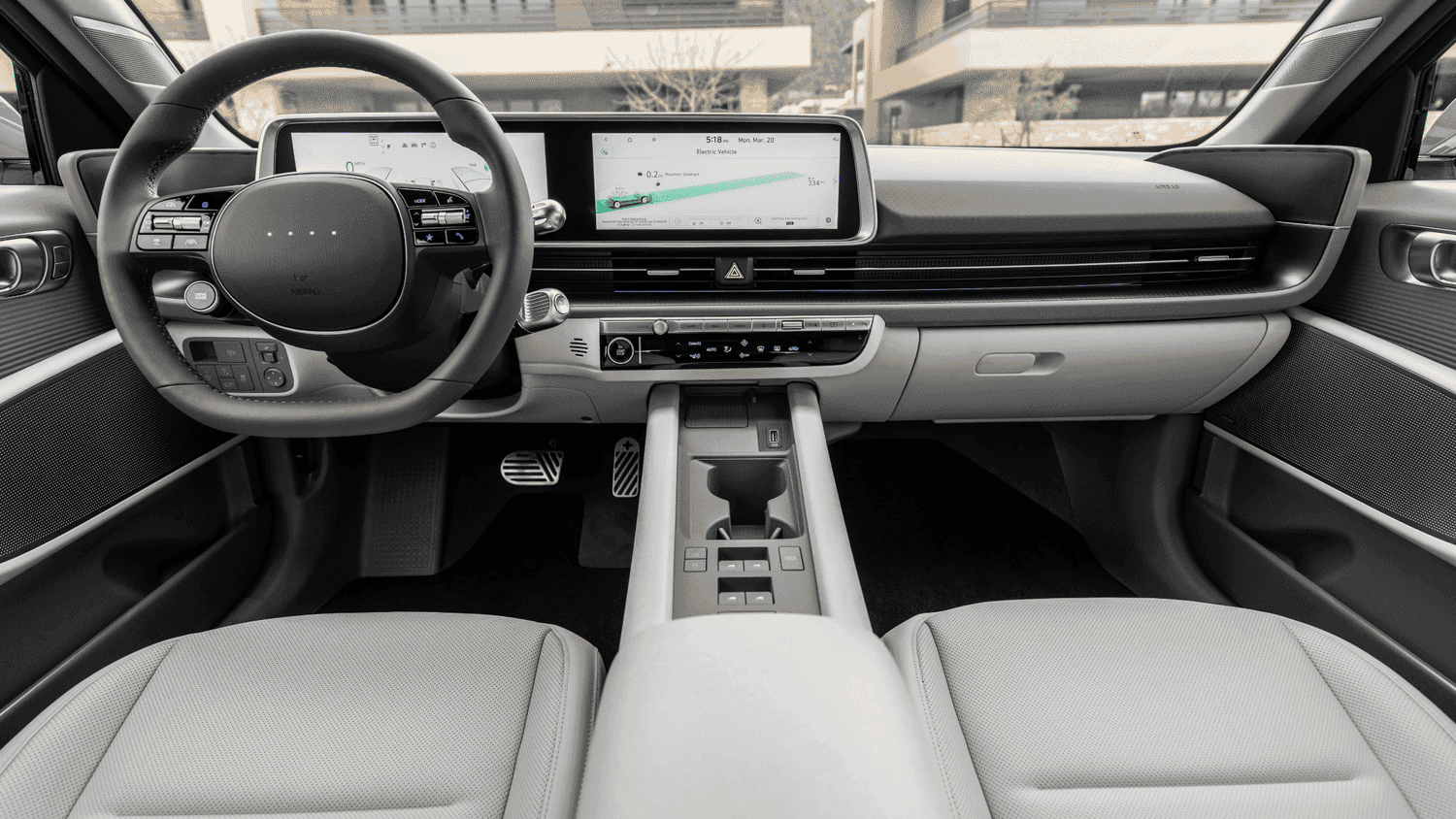 Driver’s view of the 2025 Hyundai IONIQ 6 dashboard with seamless EV interface and futuristic steering wheel