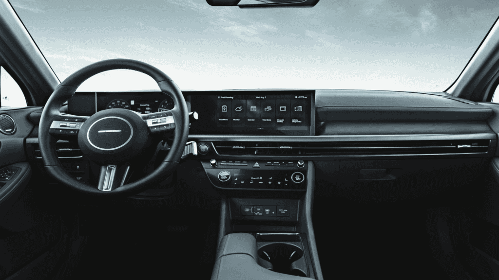 Cockpit view of the 2025 Hyundai Sonata Hybrid interior showing its dual digital displays and premium finishes