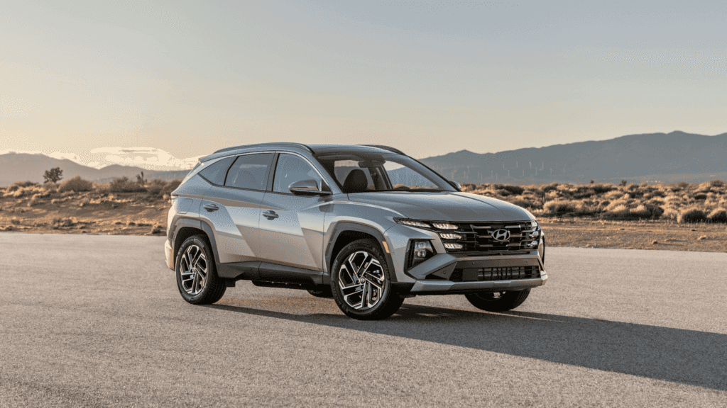 Side view of the 2025 Hyundai Tucson Plug-in Hybrid SUV at sunset near Athens, GA