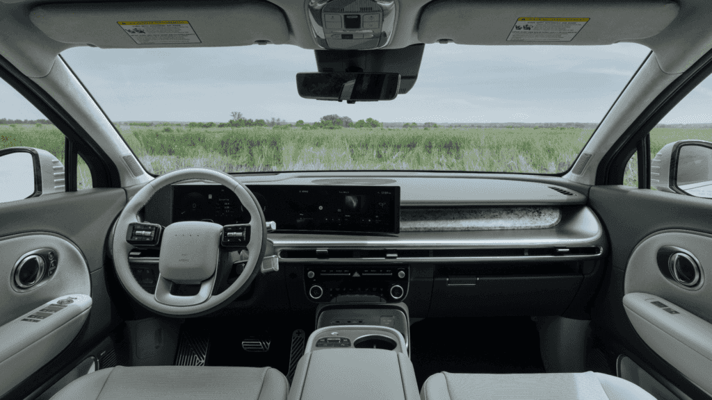2026 Hyundai IONIQ 9 interior view with wide digital display and modern EV steering design