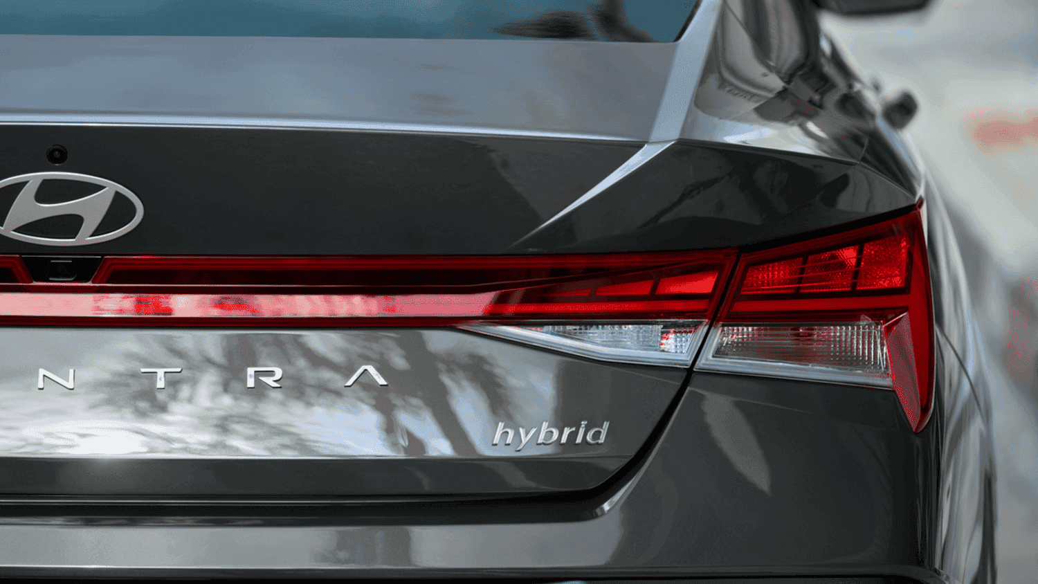 Close-up of the Elantra Hybrid’s rear badging and taillights, highlighting hybrid efficiency in Athens driving.