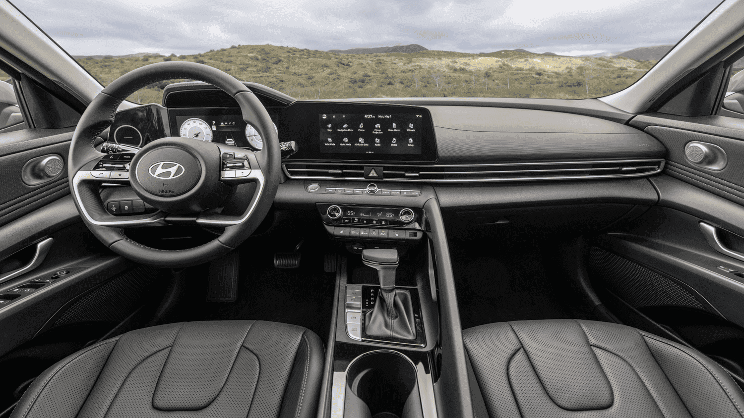Dashboard view of the 2025 Hyundai Elantra near Loganville, GA, featuring a sleek infotainment system and premium black seating.