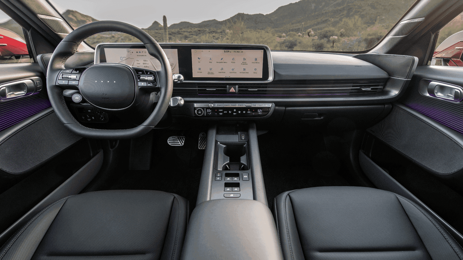 Interior cockpit of the 2025 Hyundai IONIQ 6 with dual-screen display and ambient lighting, designed for high-tech commutes around Athens, GA.
