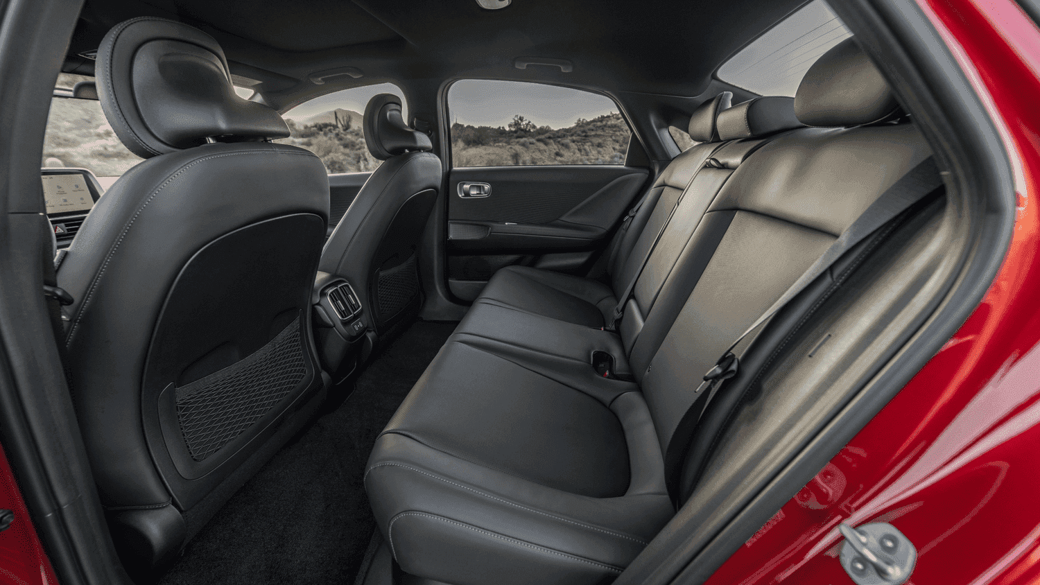 Rear seat space of the 2025 Hyundai IONIQ 6 showing premium upholstery and legroom, offering comfort for families in Athens, GA.
