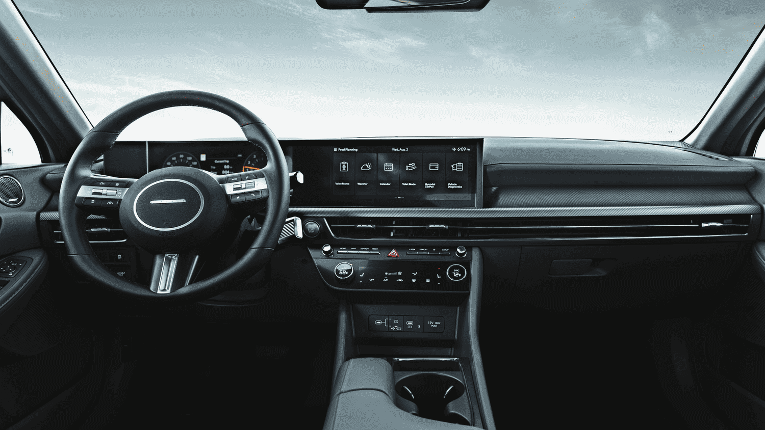 Detailed interior of the 2025 Hyundai Sonata Hybrid featuring wide touchscreen and climate controls in Athens, GA.