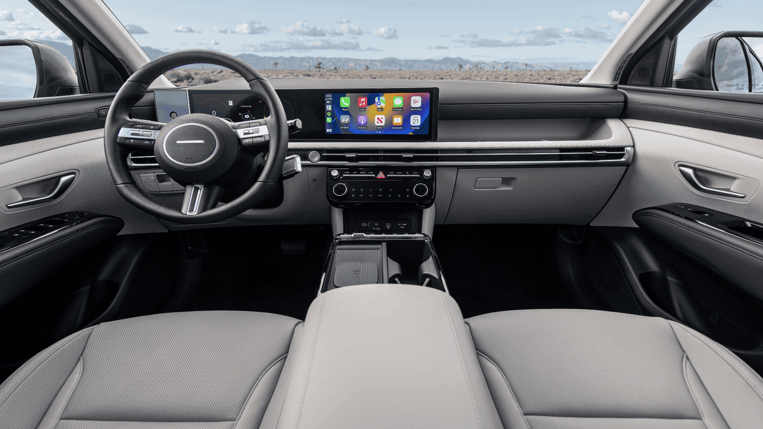 Driver-focused interior of the 2025 Hyundai Tucson featuring a large display screen, tailored for everyday commutes in Athens, GA.