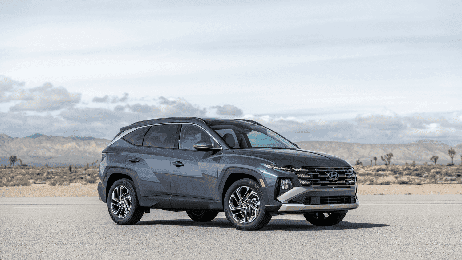 Side view of the 2025 Hyundai Tucson parked near Loganville, GA, emphasizing its sharp lines and sporty crossover style.