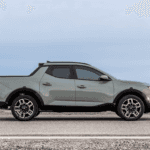 2025 Hyundai Santa Cruz pickup truck parked near Loganville, GA, showing off its versatile smart cargo system and unique design.