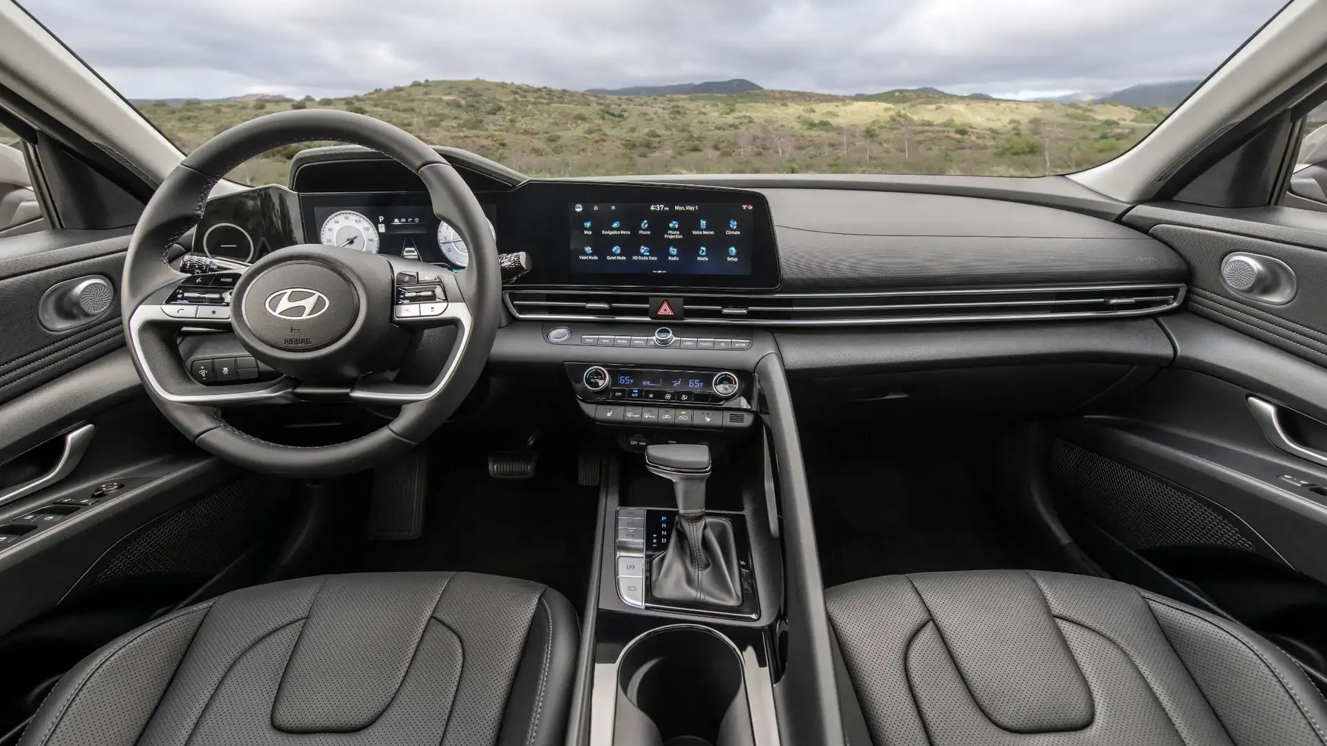 2026 Hyundai Elantra interior with black leather seats, touchscreen display, and digital gauges.