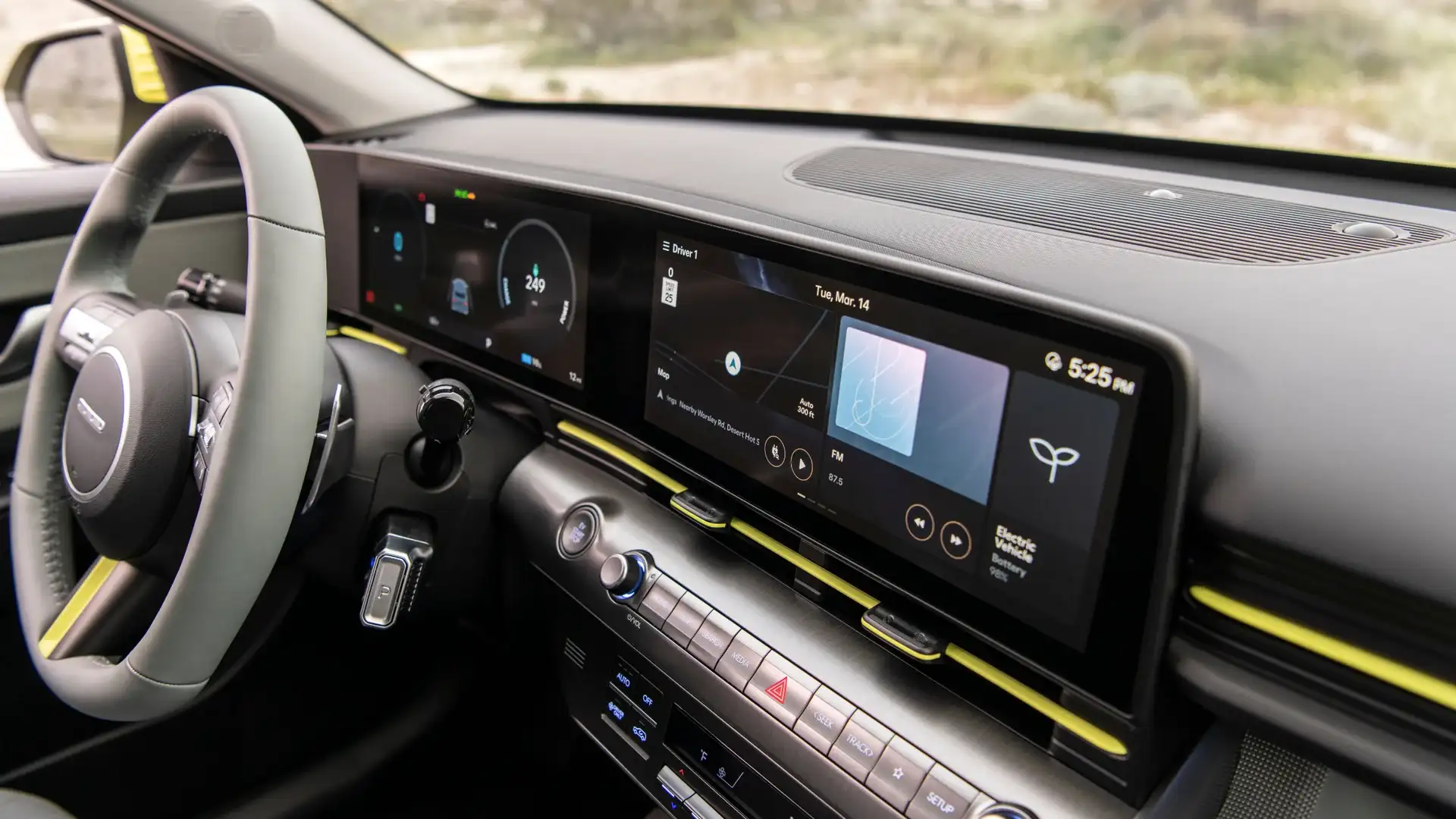 2026 Hyundai Kona Electric interior with dual digital displays, steering wheel controls, and modern dash.
