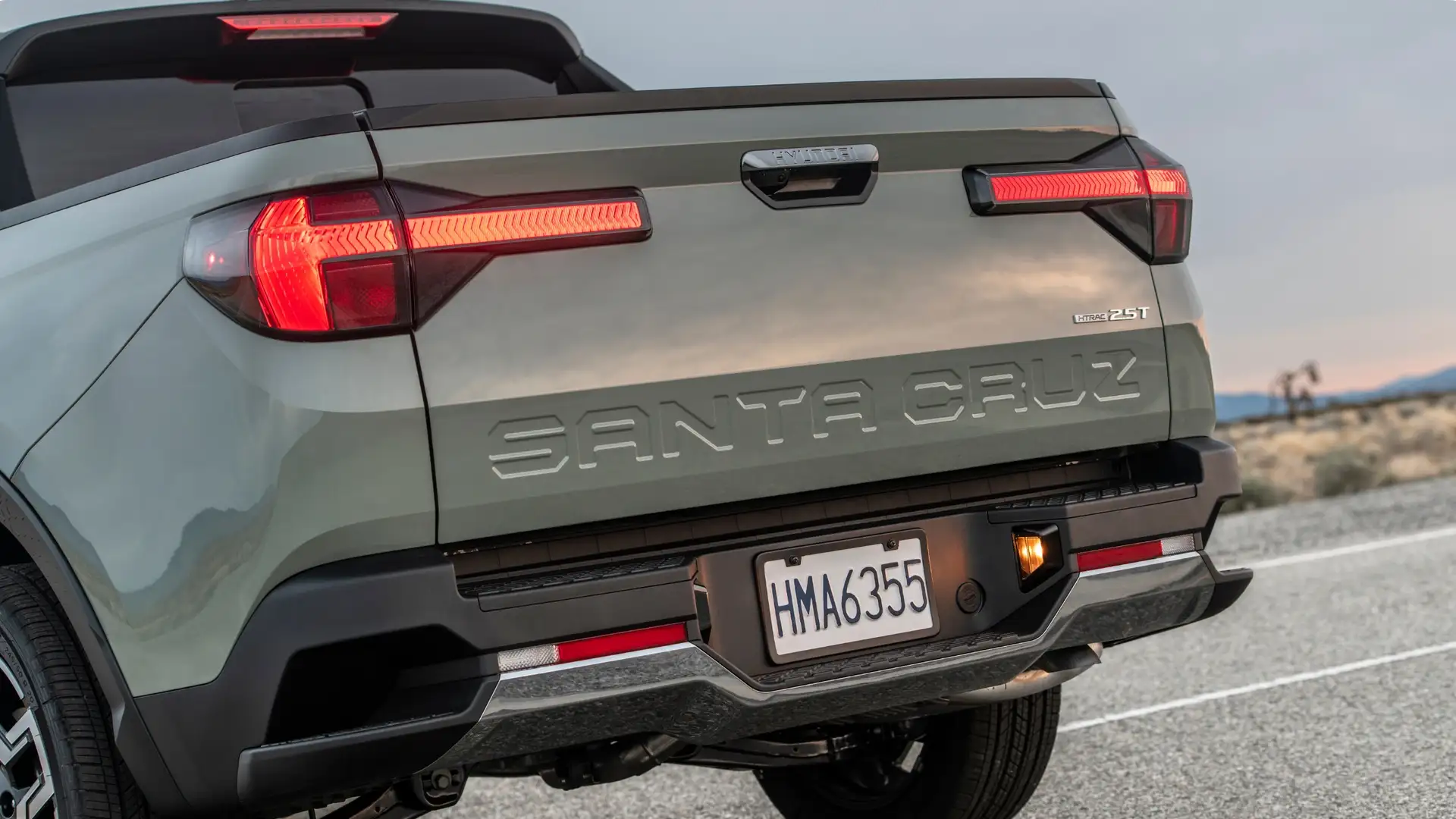 2025 Hyundai Santa Cruz rear tailgate close-up highlighting sculpted SANTA CRUZ badging.