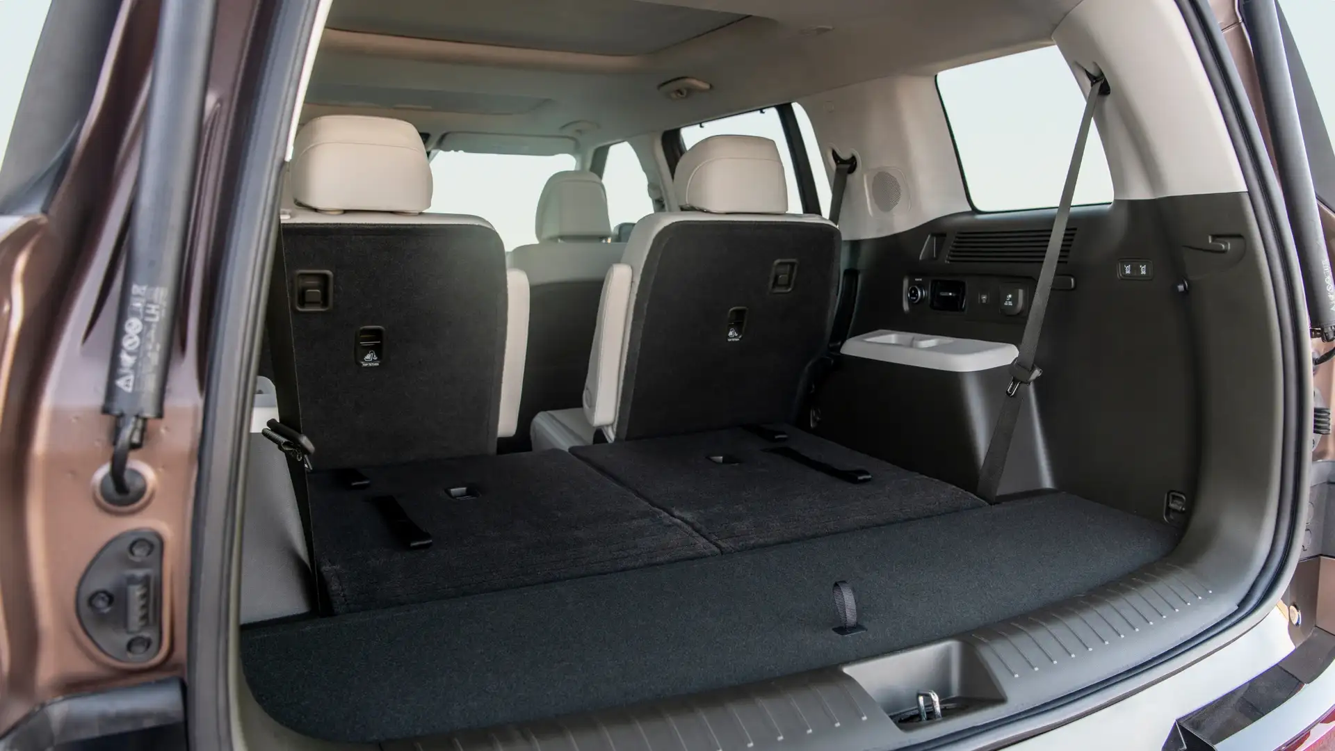 2026 Hyundai Santa Fe Hybrid cargo area with rear seats folded for expanded storage space.