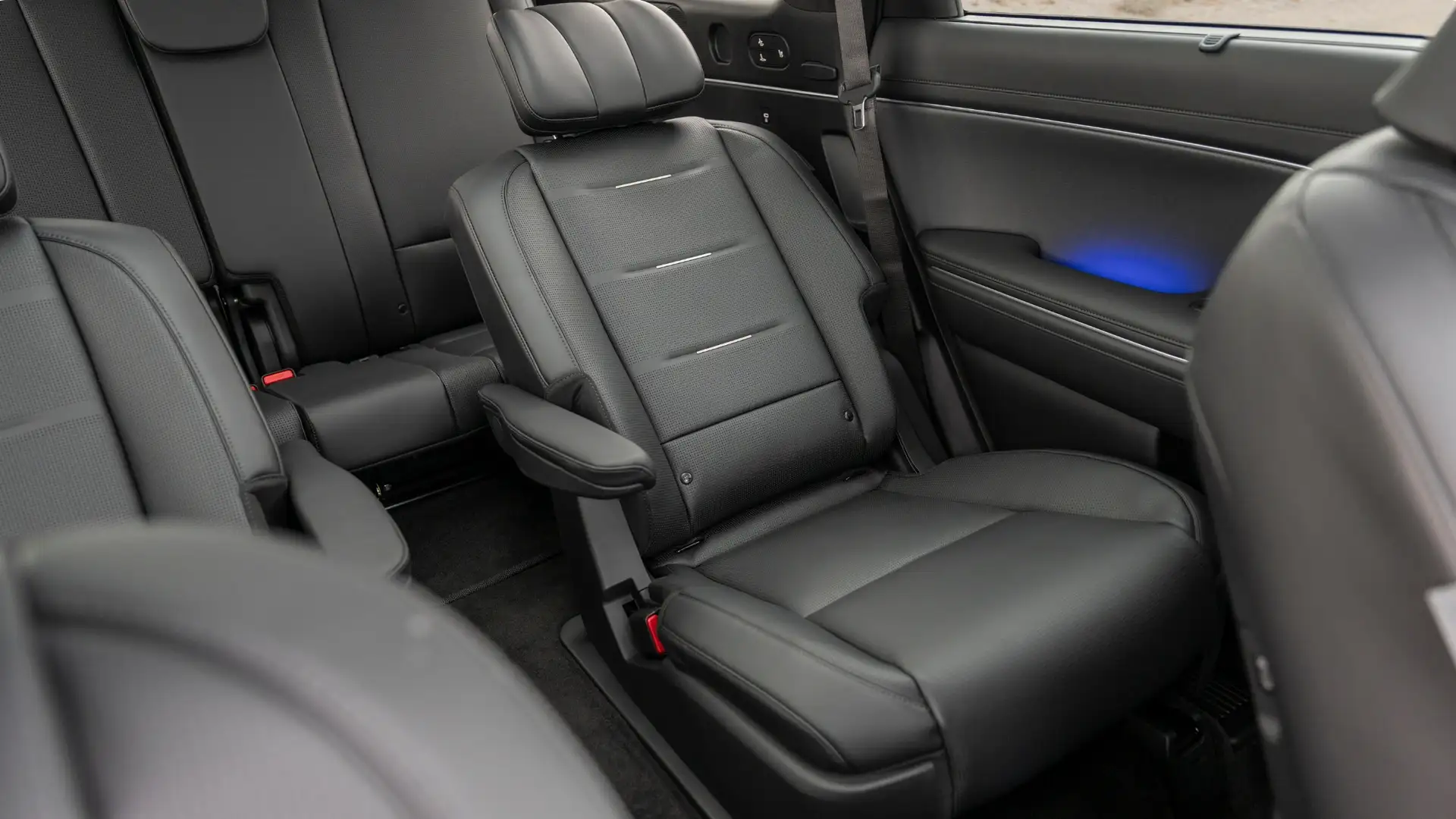 2026 Hyundai Palisade second-row captain’s chair in black leather with ambient lighting detail.