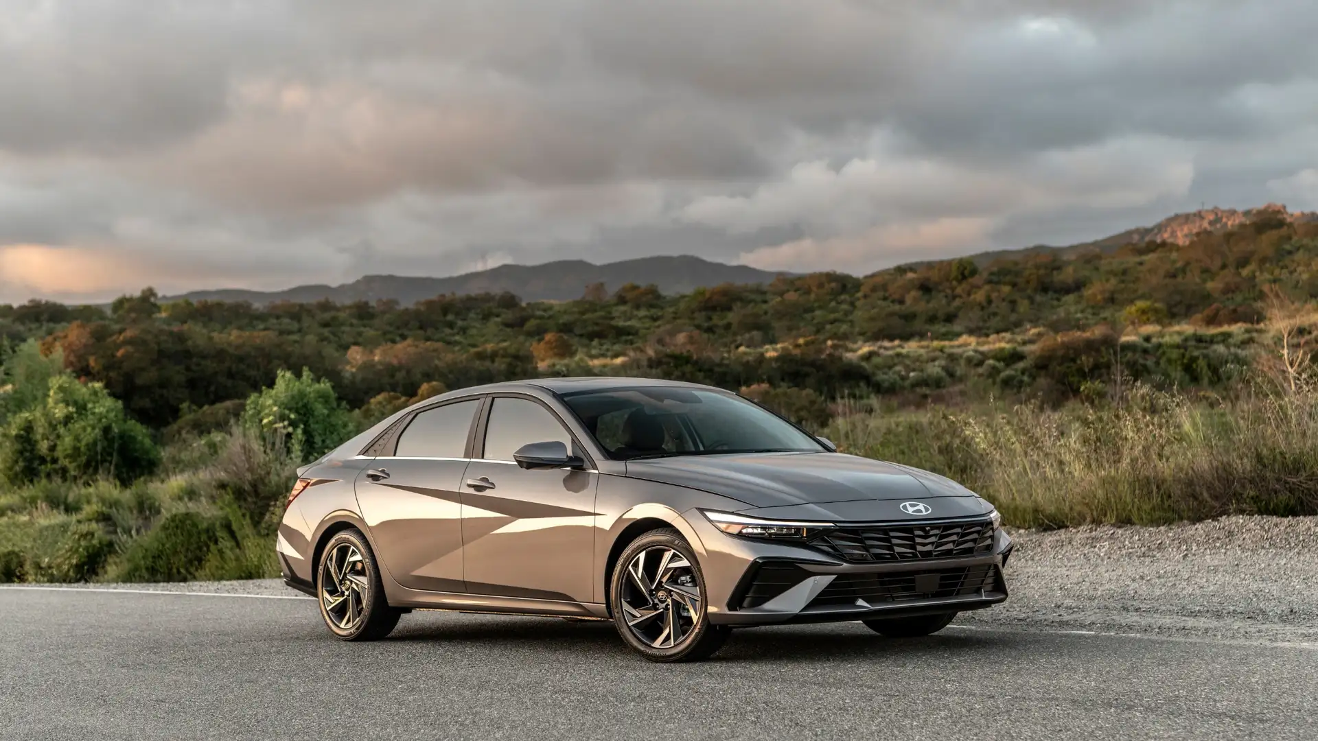2026 Hyundai Elantra sedan exterior front three quarter view in metallic gray.