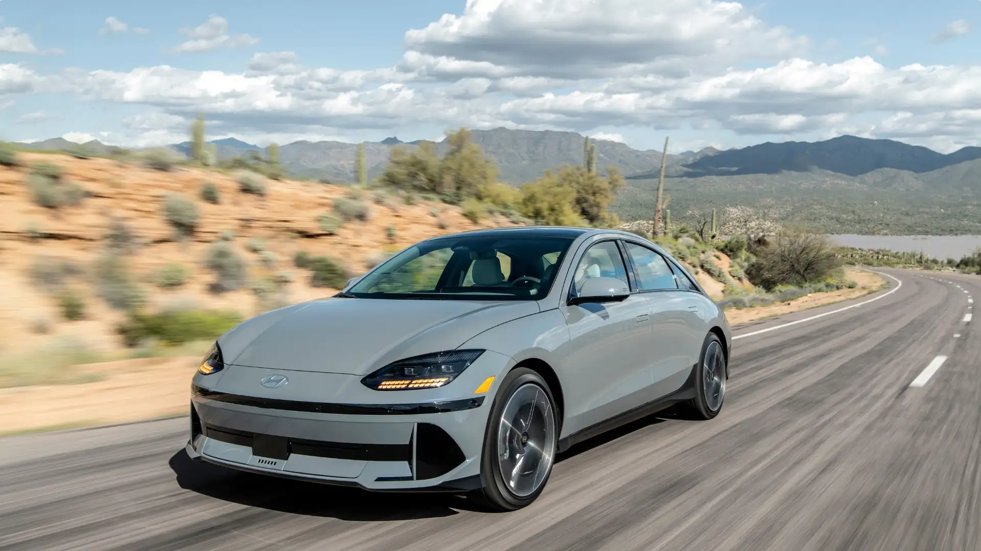 2026 Hyundai IONIQ 6 electric sedan exterior driving view in light gray.