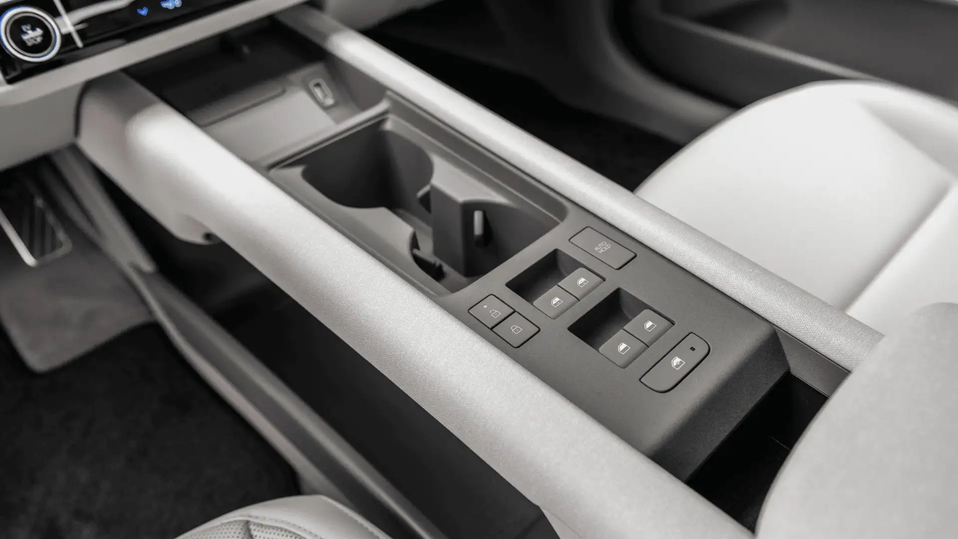 2026 Hyundai IONIQ 6 center console showing cupholders, window controls, and minimalist interior design.