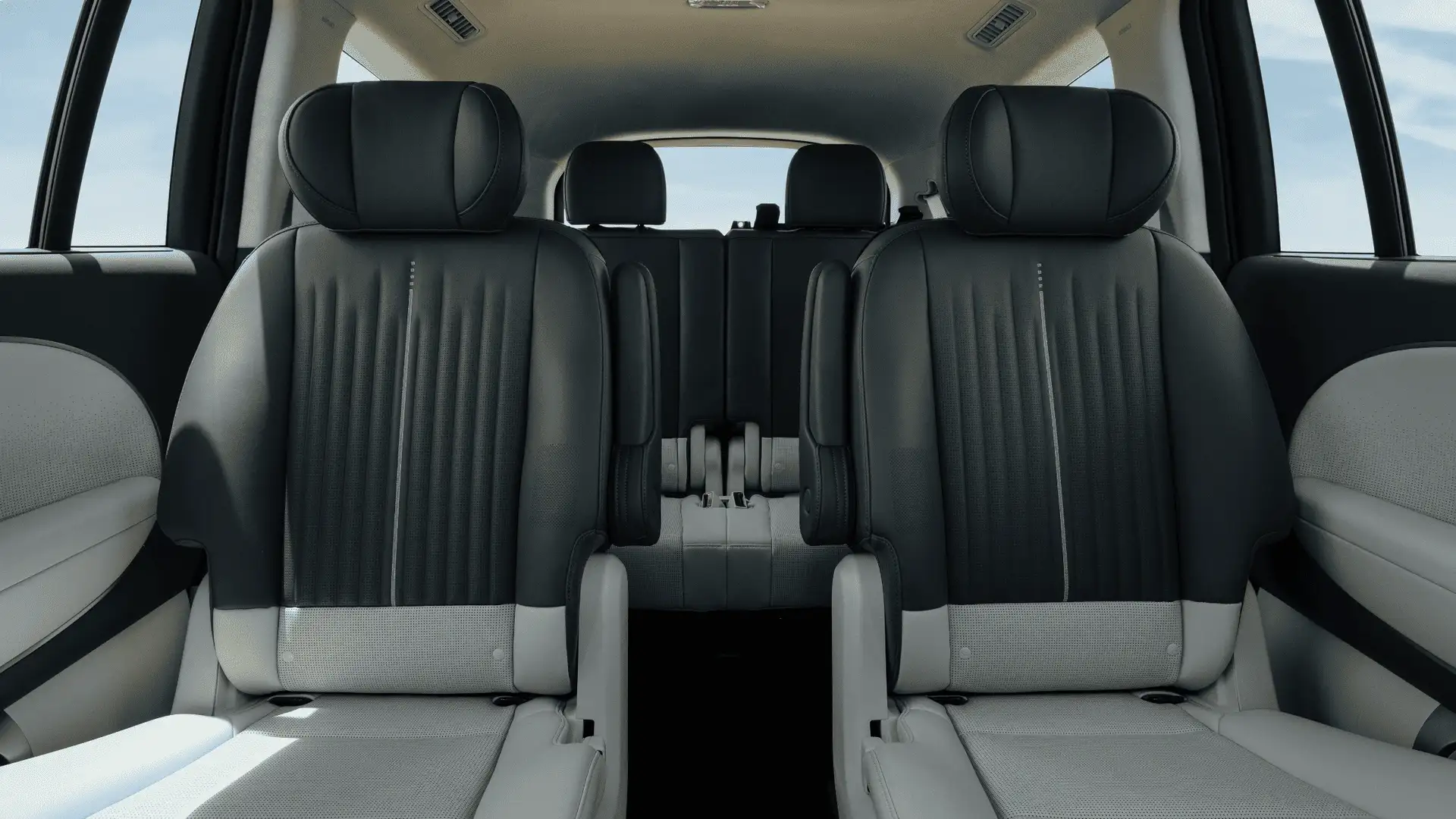 2026 Hyundai IONIQ 9 interior second row seating with black and gray upholstery and spacious cabin design.