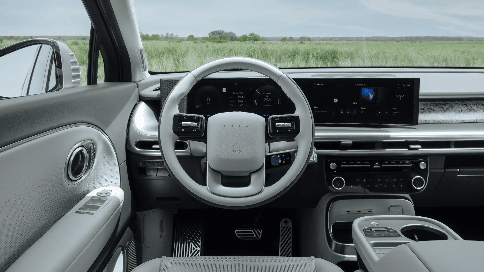 2026 Hyundai IONIQ 9 driver cockpit with digital display, steering wheel controls, and modern dashboard layout.