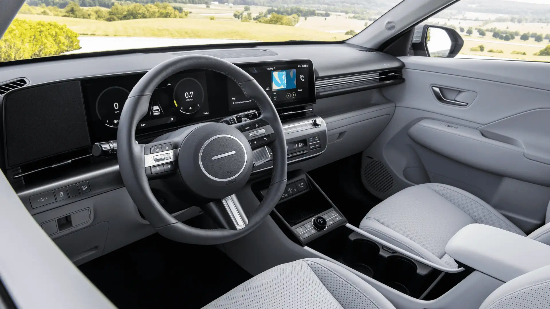 2026 Hyundai Kona interior cockpit view featuring digital cluster, widescreen display, and modern center console.