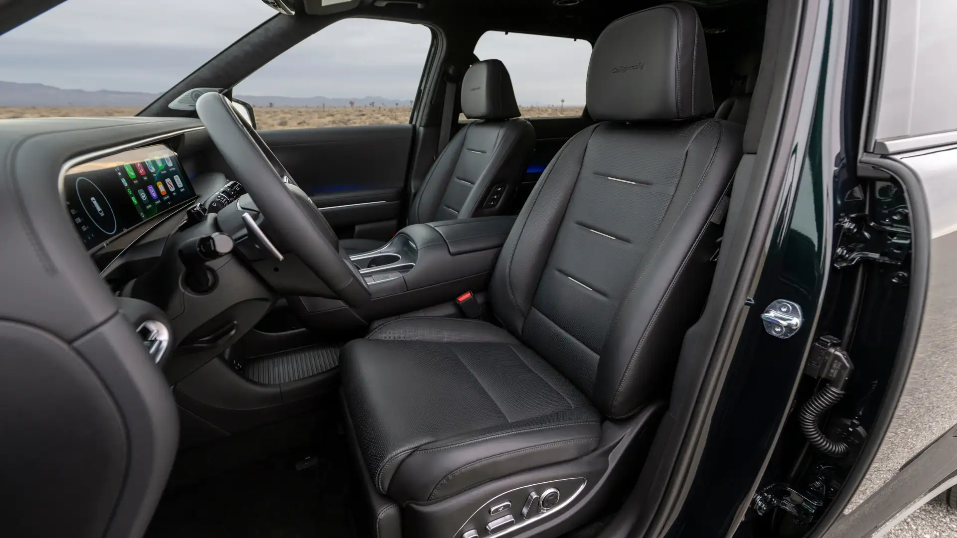 2026 Hyundai Palisade front interior with black leather seats, digital dashboard, and premium cabin materials.