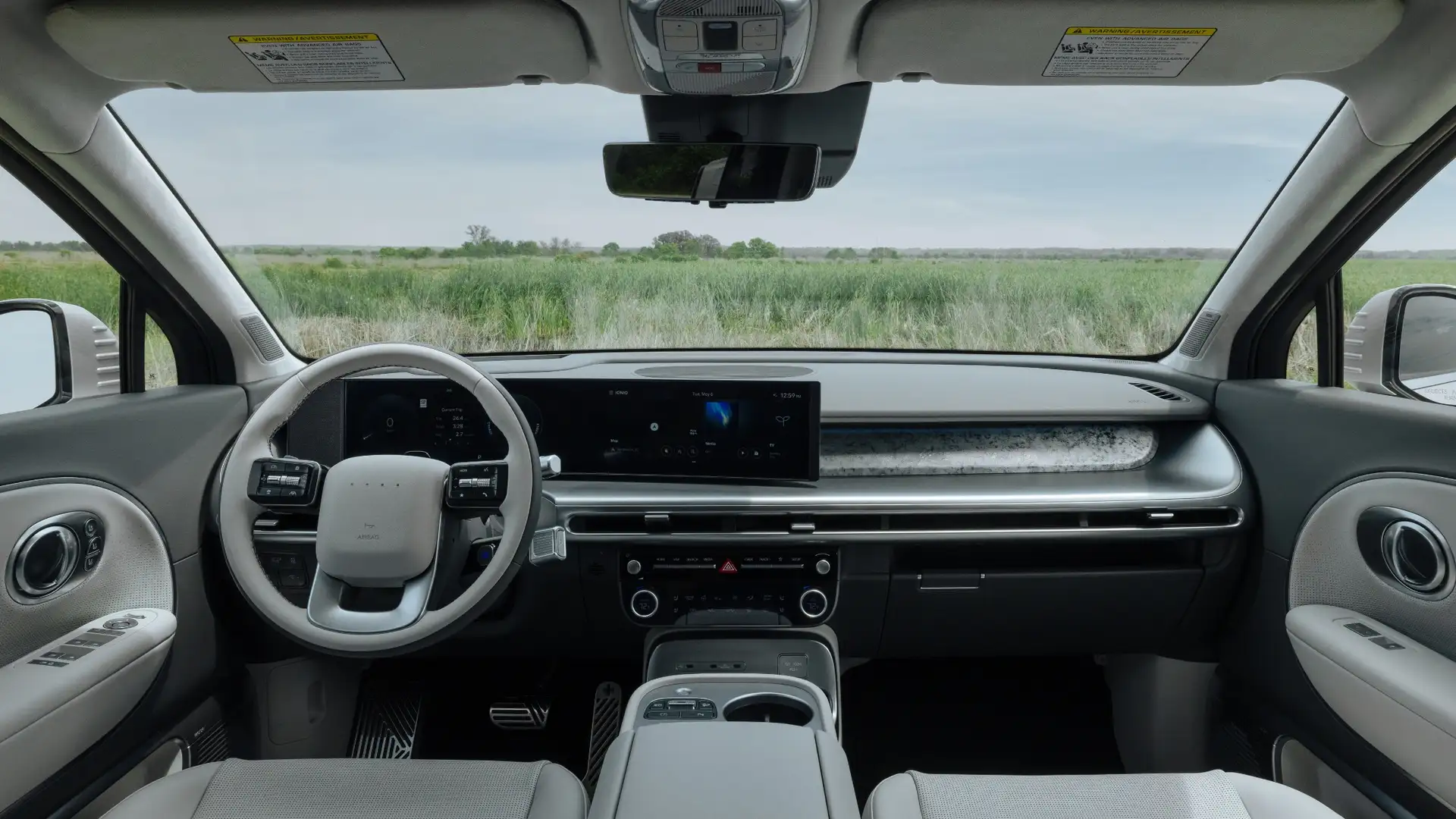 Front dashboard of the 2026 Hyundai IONIQ 9 featuring wide digital displays and a clean modern interior layout.