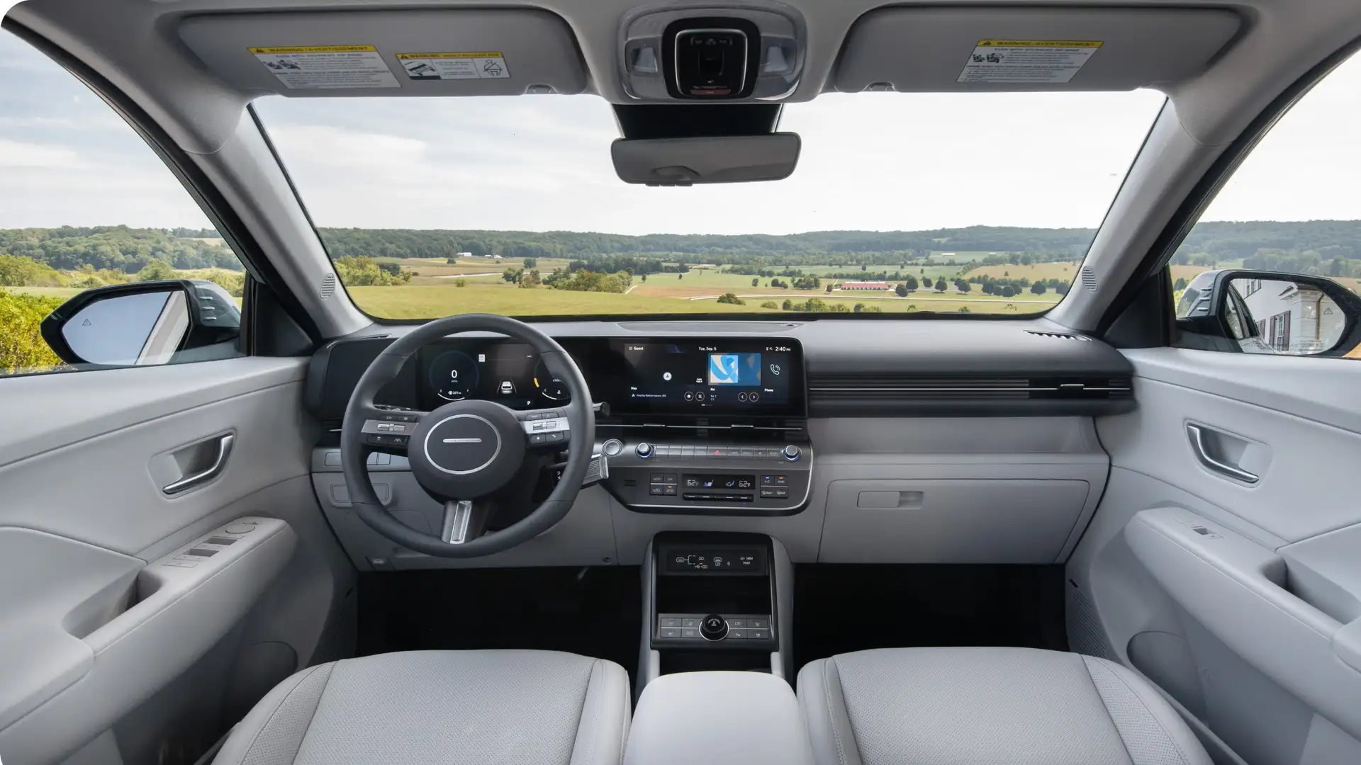2026 Hyundai Kona interior featuring digital dashboard, widescreen display, modern controls, and refined cabin layout.