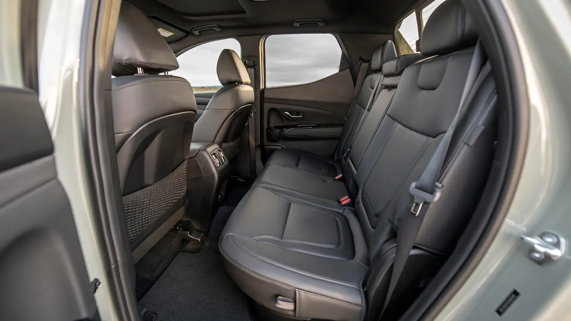 2026 Hyundai Santa Cruz rear seat interior featuring leather seating, legroom space, and rear passenger layout.