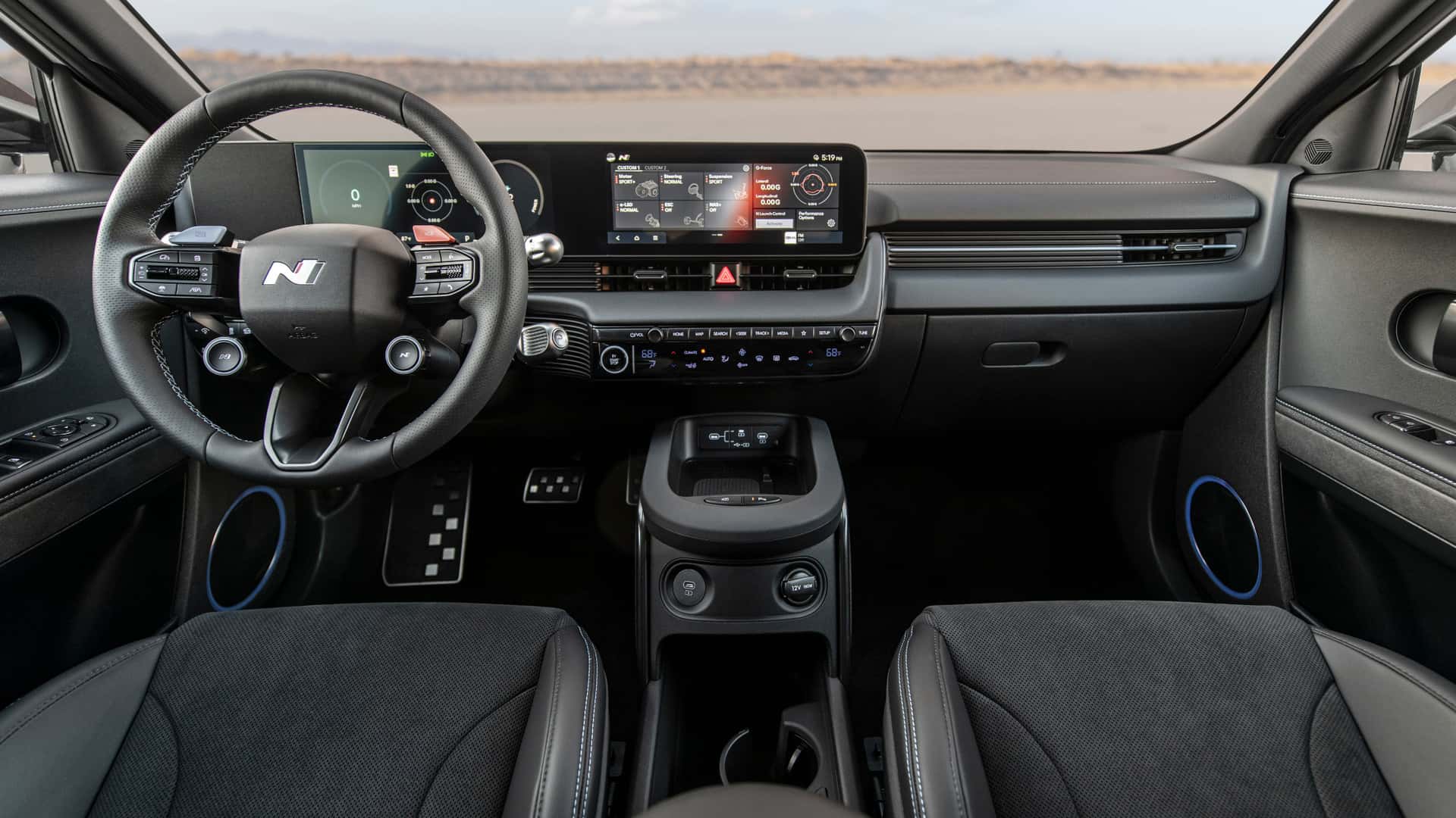 2026 Hyundai IONIQ 5 N cockpit view with N steering wheel, performance displays, center touchscreen, and sporty black interior.