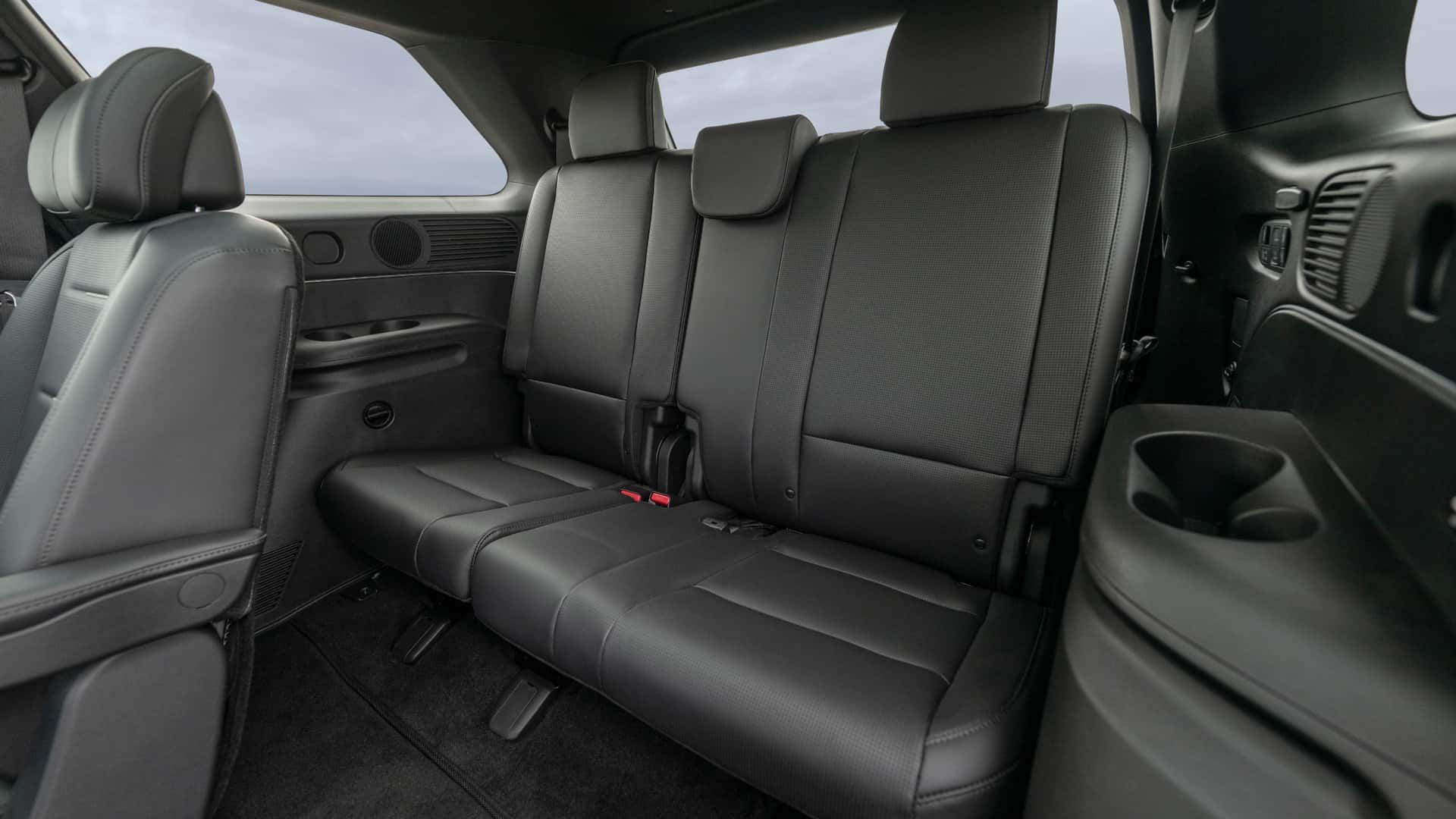2026 Hyundai Palisade third-row seating with black leather upholstery and rear cabin space.