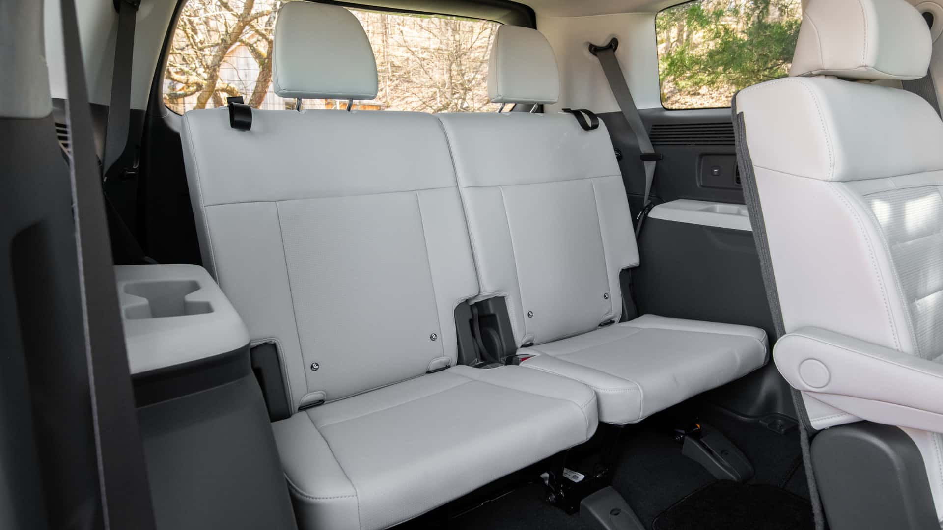 2026 Hyundai Santa Fe third-row seating area with light upholstery, headrests, and rear cabin space.