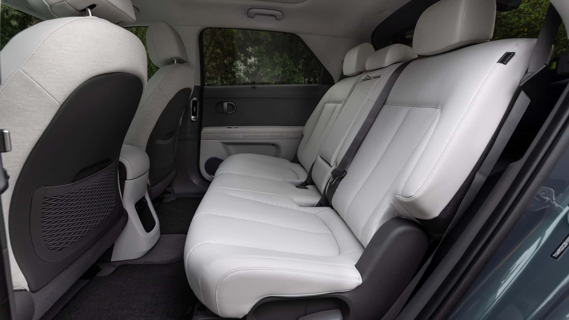 2026 Hyundai IONIQ 5 rear seating area with light upholstery and spacious passenger room.